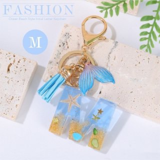 Brelok do kluczy LITERKA "M" , MORSKI, ogon syreny, muszelki, frędzle BRL353M